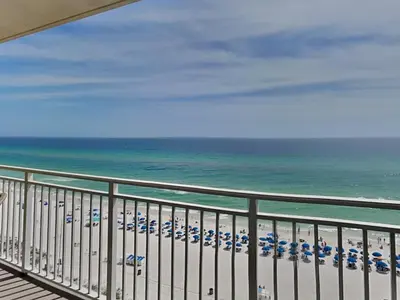 a view of a beach with umbrellas and the ocean at Emerald Beach #1032 in Panama City Beach