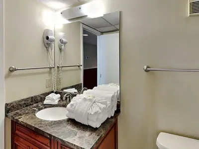 a bathroom with a sink and a mirror at Edgewater Tower II #209 in Panama City Beach