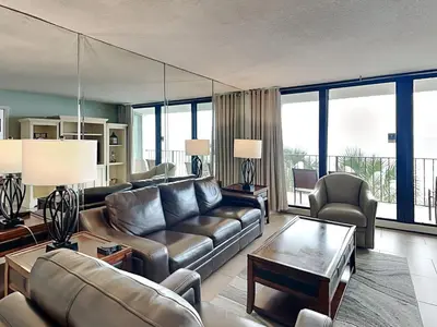a living room with a couch and a table at Edgewater Tower II #209 in Panama City Beach
