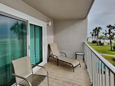two chairs and a table on a balcony at Summit Beach Resort #222 in Panama City Beach
