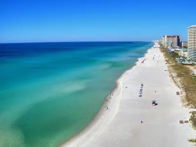 an aerial view of a beach and the ocean at Summit Beach Resort #222 in Panama City Beach