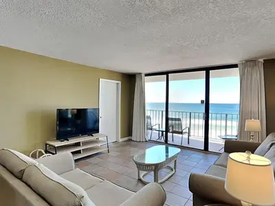 a living room with a view of the ocean at Edgewater Tower III #604 in Panama City Beach