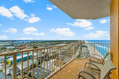 a balcony with a view of the beach and the ocean at Treasure Island #1401 in Panama City Beach
