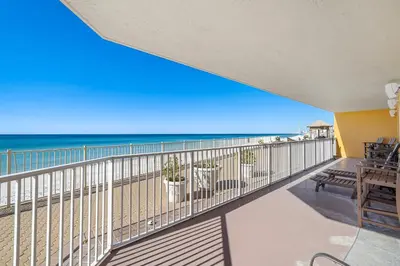 a balcony with a view of the beach at Treasure Island #0101 in Panama City Beach