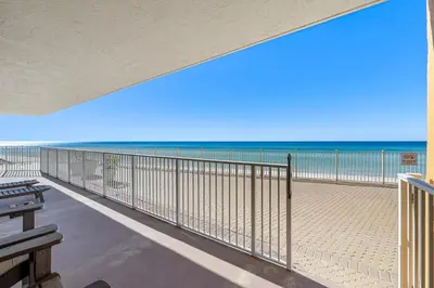 a balcony with a view of the beach at Treasure Island #0101 in Panama City Beach