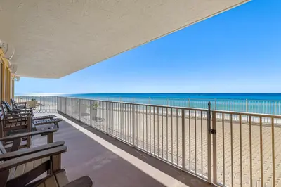 a view of the beach from the balcony of a beach house at Treasure Island #0101 in Panama City Beach