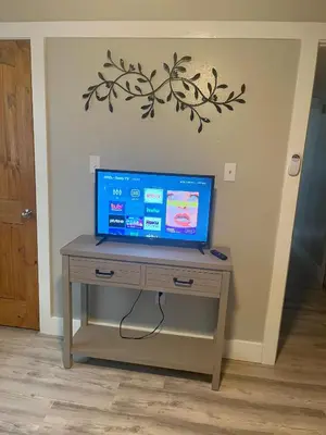 a tv sitting on a table in a room at 2 bedroom duplex in Panama City Beach Florida -upstairs unit in Panama City Beach