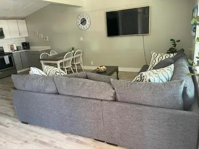 a living room with a couch and a table at 2 bedroom duplex in Panama City Beach Florida -upstairs unit in Panama City Beach