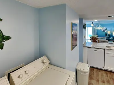 a bathroom with a sink and a toilet in a room at Moonspinner 415A in Panama City Beach