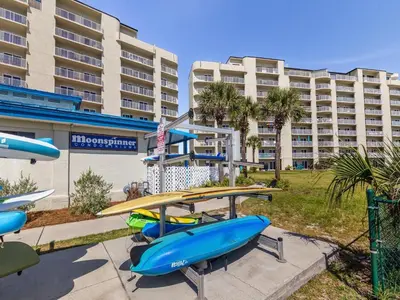 a group of surfboards on display in front of a hotel at Moonspinner 415A in Panama City Beach