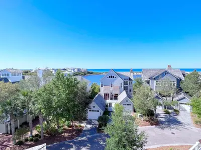 an aerial view of a house with a lake at Watersound 13 - Hosted by Top Villas in Watersound Beach