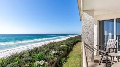 a balcony with a view of the beach at South Shore 30A by AvantStay Gulf View Pool Bonfires in Rosemary Beach
