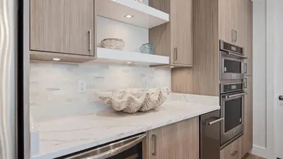 a kitchen with a counter with a bowl on it at Out of Office Beaches Private Pool Steps to Beach Sleeps 15 in Rosemary Beach