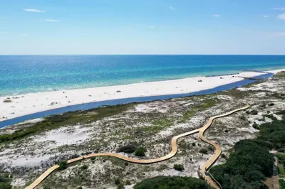 an aerial view of a beach with a winding road at Gulf Front- Large Pool- Watersound on 30A in Santa Rosa Beach