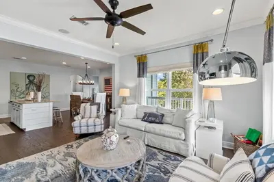 a living room with a couch and a table at 6-Seater Golf Cart - Community Pool - Close to Beach, Dining and Shopping in Inlet Beach