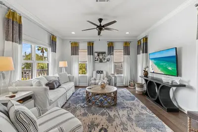 a living room with a couch and a tv at 6-Seater Golf Cart - Community Pool - Close to Beach, Dining and Shopping in Inlet Beach