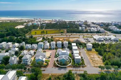 an aerial view of a city with houses and the ocean at 6-Seater Golf Cart - Community Pool - Close to Beach, Dining and Shopping in Inlet Beach
