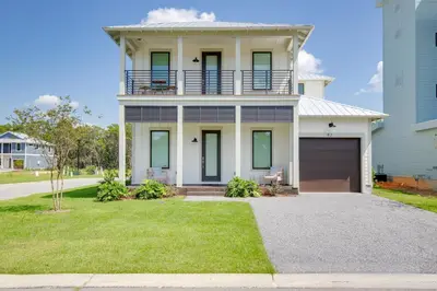 a large white house with a garage at Community Pool, Close to Beach, Great Location! in Inlet Beach