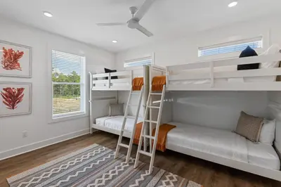 a bedroom with two bunk beds and a couch at Community Pool, Close to Beach, Great Location! in Inlet Beach