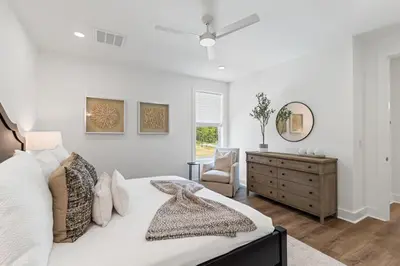 a white bedroom with a bed and a dresser at Community Pool, Close to Beach, Great Location! in Inlet Beach