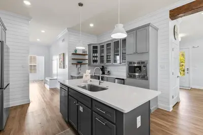 a kitchen with a sink and a counter top at Pool, 30A, Fire Table, Gourmet Kitchen, Luxury in Santa Rosa Beach