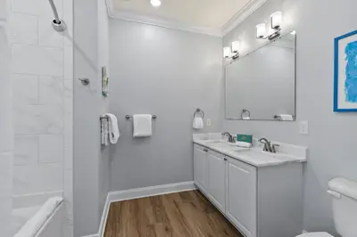 a white bathroom with a sink and a shower at Pool, 30A, Fire Table, Gourmet Kitchen, Luxury in Santa Rosa Beach