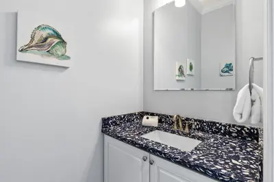 a bathroom with a sink and a mirror at Pool, 30A, Fire Table, Gourmet Kitchen, Luxury in Santa Rosa Beach