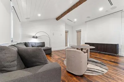 a living room with a couch and a table at Tranquility on the Preserve in Watersound Beach