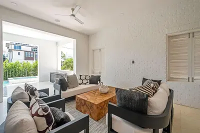 a living room with a couch and a table at No More Cloudy Days in Santa Rosa Beach