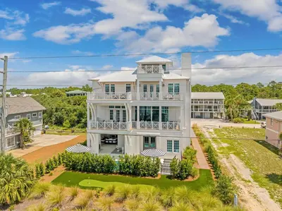an aerial view of a large white house at No More Cloudy Days in Santa Rosa Beach