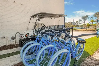 a group of blue bikes parked next to a building at Breezy Blue in Santa Rosa Beach