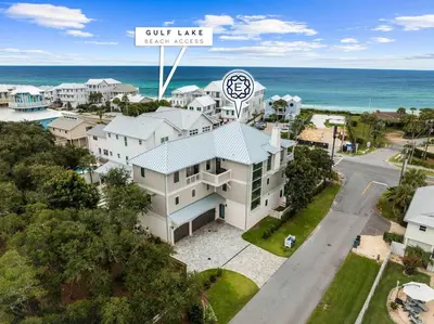 an aerial view of a house with the ocean in the background at Eyes on Sunrise in Seacrest