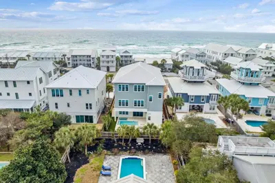 an aerial view of a row of houses and the ocean at Coastal Comfort in Seacrest