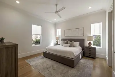 a bedroom with a bed and a ceiling fan at Gulf Shore Manor in Santa Rosa Beach