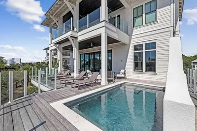 a house with a swimming pool and a patio at Gulf Shore Manor in Santa Rosa Beach
