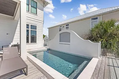 a swimming pool in the backyard of a house at Gulf Shore Manor in Santa Rosa Beach