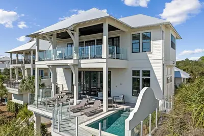 a large white house with a swimming pool at Gulf Shore Manor in Santa Rosa Beach