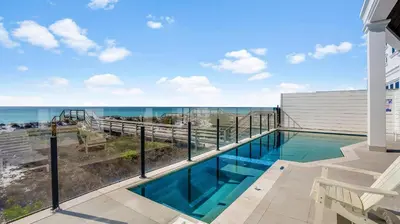 a swimming pool with a view of the ocean at Azzurro Dream in Seagrove Beach