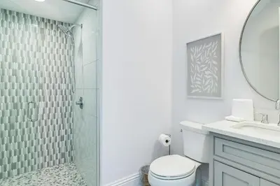 a bathroom with a shower and a toilet and a sink at Azzurro Sky in Seagrove Beach