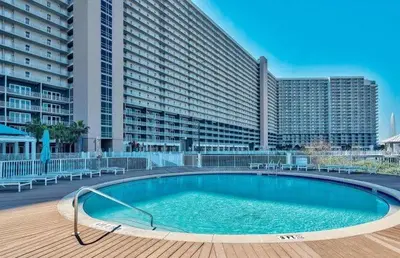 a large swimming pool in front of a large building at Panama City -3 Bedroom - Laketown Wharf in Panama City Beach