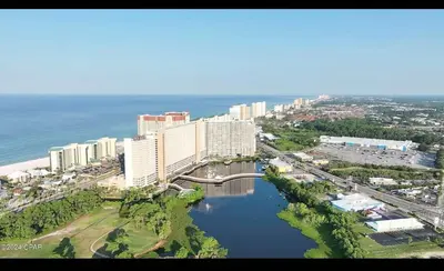 an aerial view of a city with a bridge over a river at Panama City -3 Bedroom - Laketown Wharf in Panama City Beach