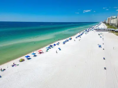 an overhead view of a beach with umbrellas and the ocean at Panama City -3 Bedroom - Laketown Wharf in Panama City Beach
