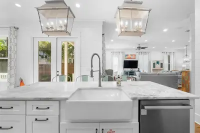 a kitchen with a sink and a counter top at 30A Beach House - Under the Palms by Panhandle Getaways in Santa Rosa Beach