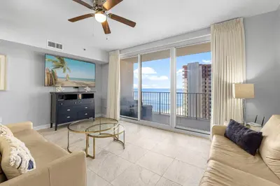 a living room with a couch and a large window at Shores Of Panama #1826 in Panama City Beach