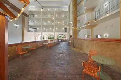 a room with tables and chairs in a building at Shores Of Panama #1930 in Panama City Beach