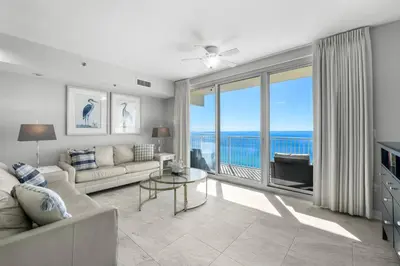 a living room with a couch and a view of the ocean at Shores Of Panama #1830 in Panama City Beach