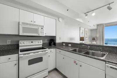 a kitchen with white appliances and a sink at Shores Of Panama #1830 in Panama City Beach