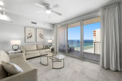 a living room with a couch and a large window at Shores Of Panama #1927 in Panama City Beach