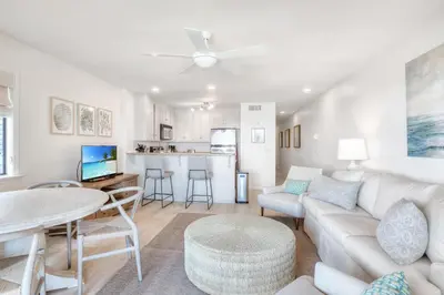 a living room with a couch and a table at Seamist #8 in Seacrest