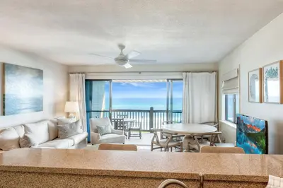 a living room with a view of the ocean at Seamist #8 in Seacrest